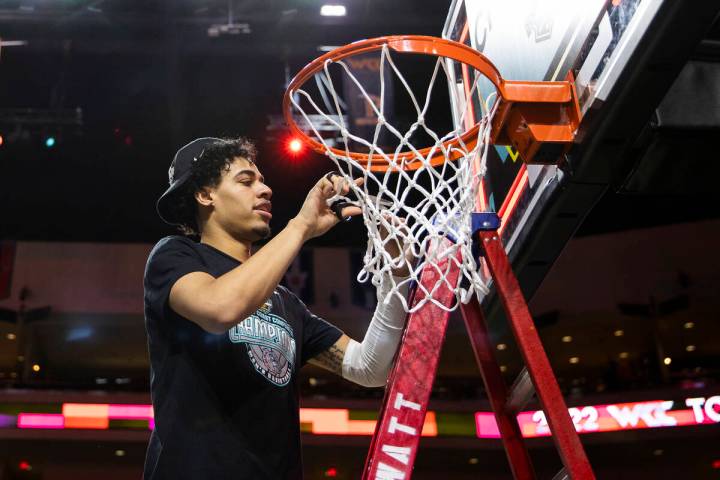 Las Vegas native and Gonzaga Bulldogs guard Julian Strawther cuts down the net after beating St ...