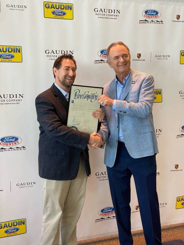 Gaudin Motor Co. owner Gary Ackerman, right, receives a proclamation from Clark County Commissi ...