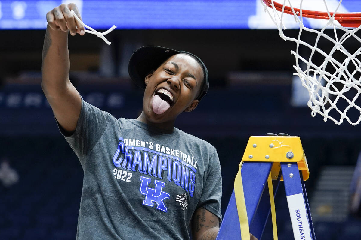Kentucky's Dre'una Edwards cuts the net after Kentucky beat South Carolina in the NCAA women's ...