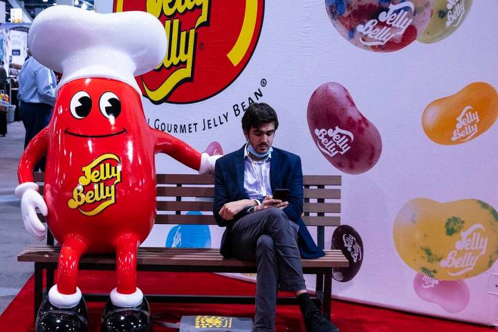 Michael Arnouts of Belgium checks his phone as he takes a break at the Fancy Food Show at the L ...