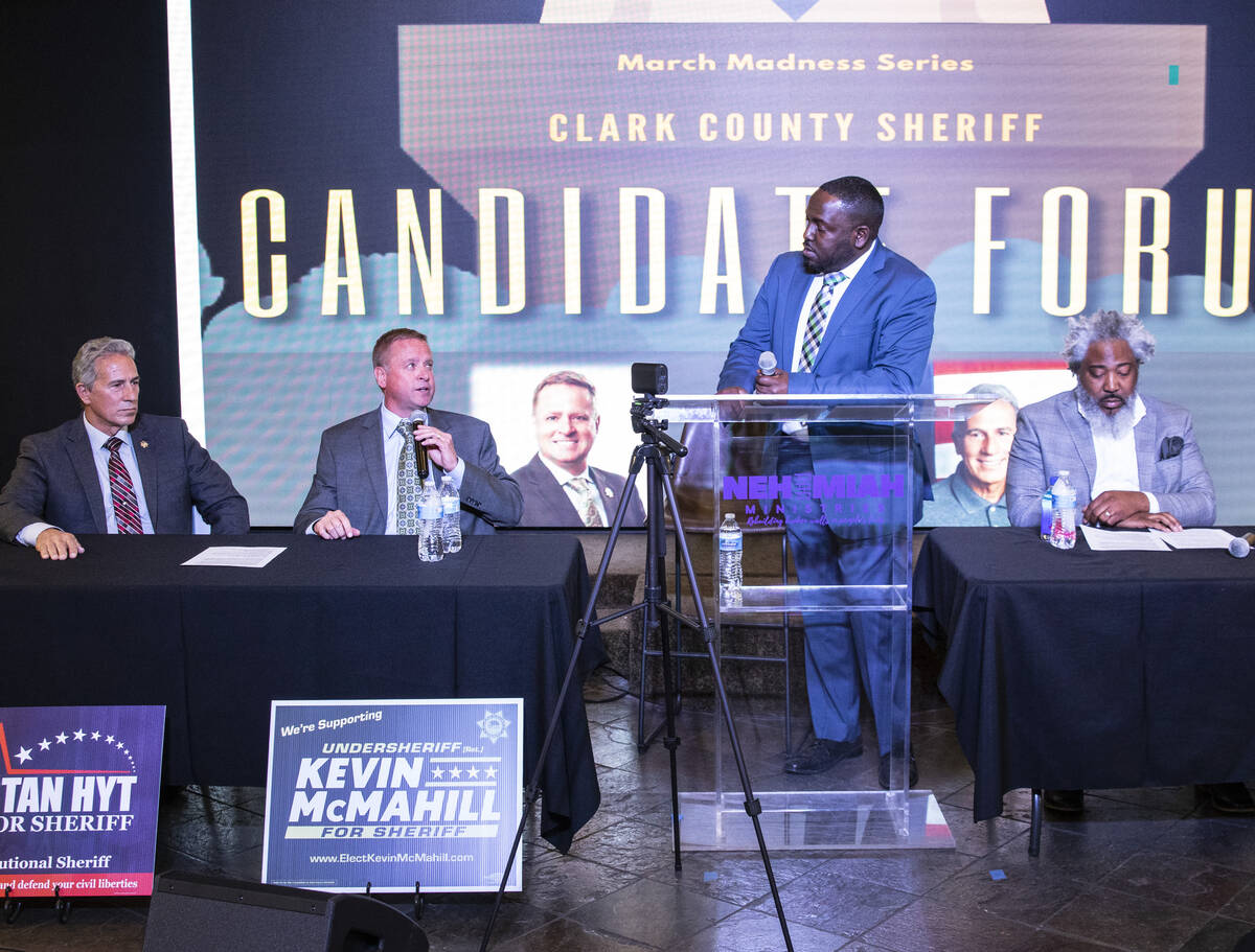 Former Undersheriff and the Clark County Sheriff candidate Kevin McMahill, center, speaks as ca ...