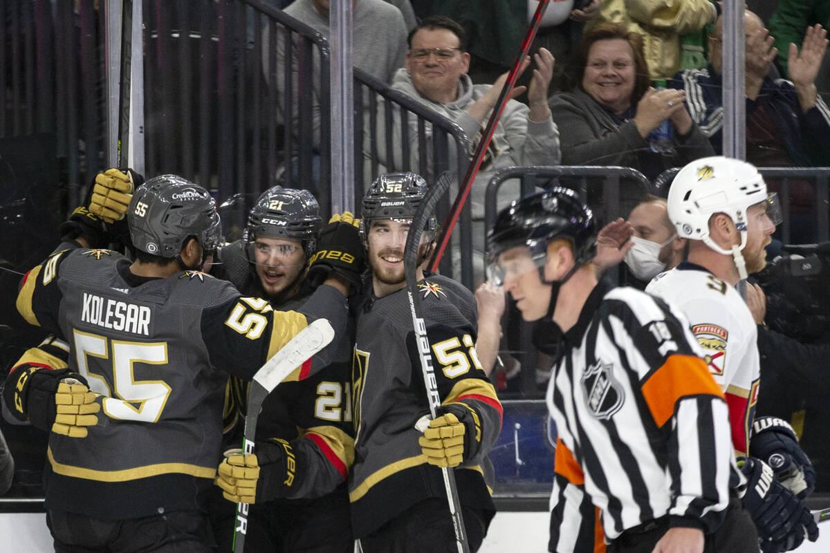 Golden Knights right wing Keegan Kolesar (55), center Brett Howden (21) and defenseman Dylan Co ...