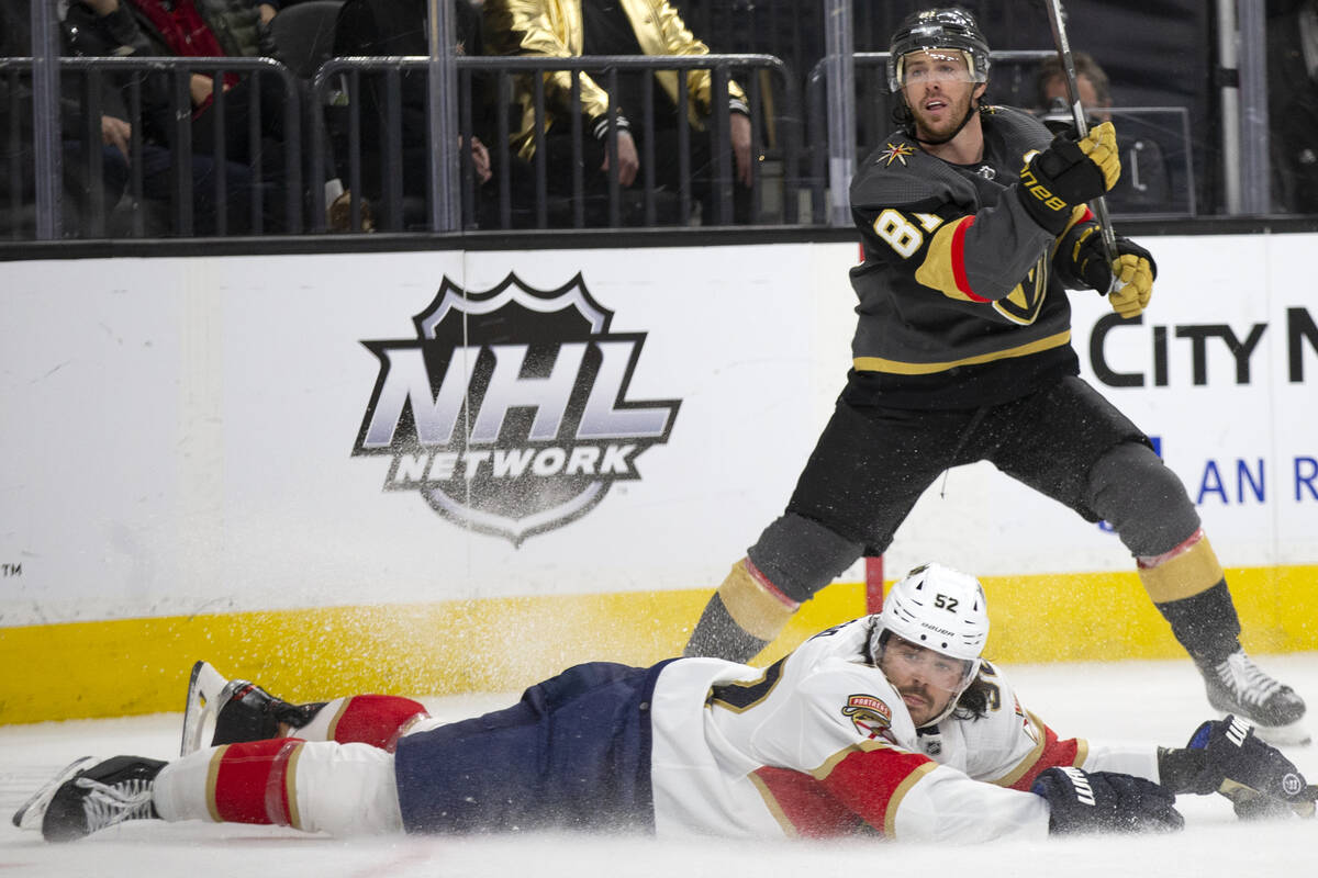 Golden Knights center Jonathan Marchessault (81) watches his slap shot while Panthers defensema ...