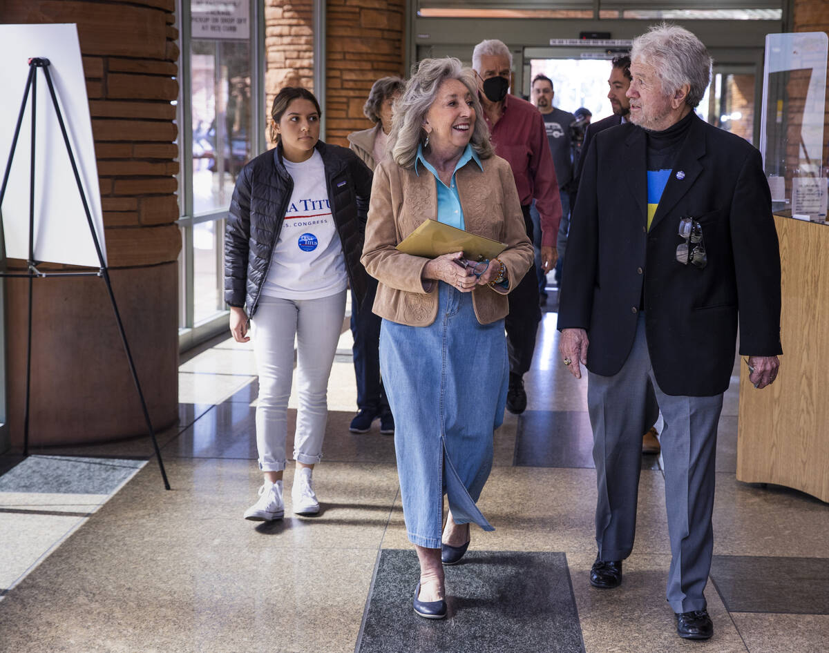 Rep. Dina Titus, D-Nev., walks with former Las Vegas City Councilman Bob Coffin as she readies ...
