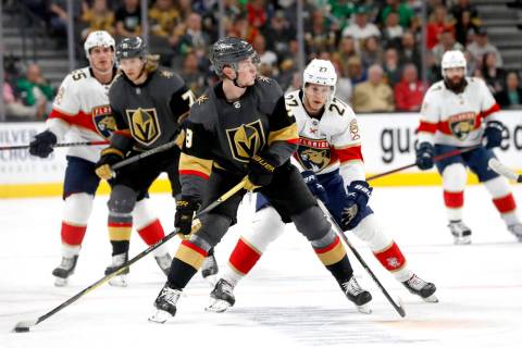 Vegas Golden Knights center Jack Eichel (9) prepares to pass in front of Florida Panthers cente ...