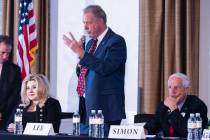 Nevada Republican governor candidates Michele Fiore, left, and Fred Simon, listen as North Las ...