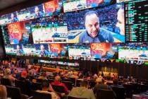 Fans watch basketball games being played on the second day of March Madness from the Circa Spor ...