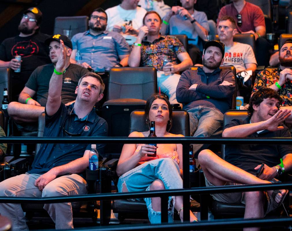 Fans watch a basketball game being played on the second day of March Madness from the Circa Spo ...