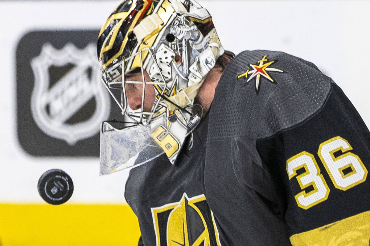 Golden Knights goaltender Logan Thompson (36) looks to grab a puck shot with the Los Angeles Ki ...