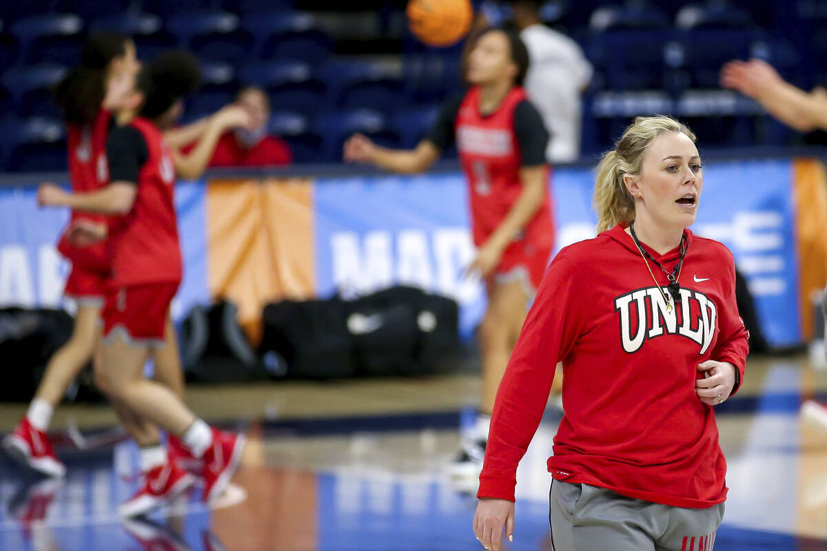 UNLV head coach Lindy La Rocque talks with her team while watching them warm up with layups dur ...