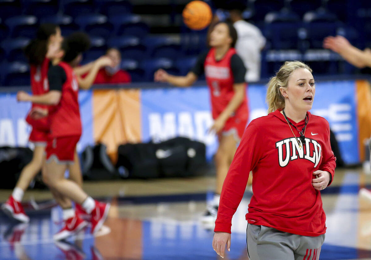 UNLV head coach Lindy La Rocque talks with her team while watching them warm up with layups dur ...