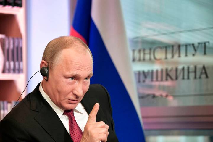 Russian President Vladimir Putin speaks during an interview in Paris last year. (Alexei Nikolsk ...