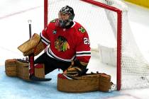 Chicago Blackhawks goaltender Marc-Andre Fleury reacts after Winnipeg Jets left wing Nikolaj Eh ...