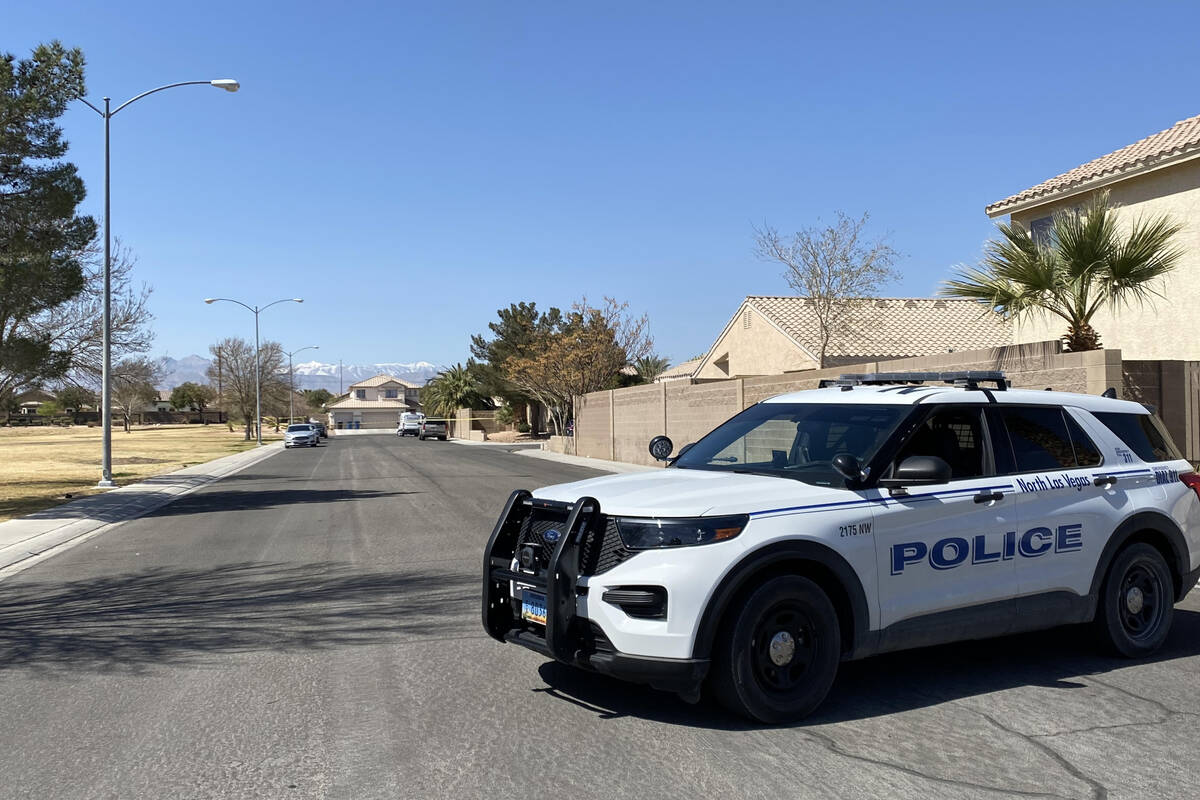 Homicide investigators in North Las Vegas block off a large swathe of an upscale neighborhood, ...