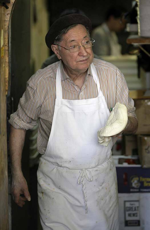 Dominico DeMarco works at his pizza parlour, DiFara's, in New York, Thursday, March 13, 2008. ...