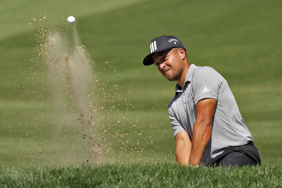 Xander Schauffele blasts from the sand trap on the fifth hole during the second round of the Va ...