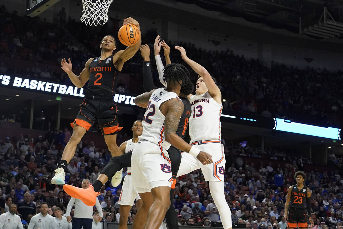 Miami guard Isaiah Wong (2) shoots against Auburn during the first half of a college basketball ...