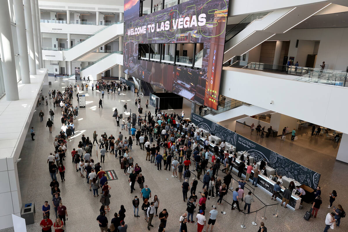 Conventioneers queue to pick up their badges at the International Pizza Expo as part of the fir ...