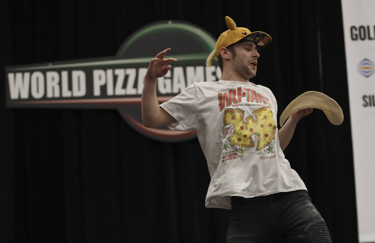 Nathan Wilson, of Bellefontaine, Ohio, competes in the freestyle acrobatic dough tossing compet ...