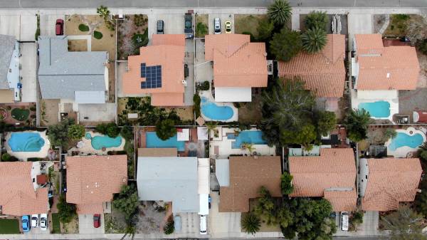 This Feb. 16, 2019, file photo shows aerial view of homes with swimming pools near Navarre Lane ...