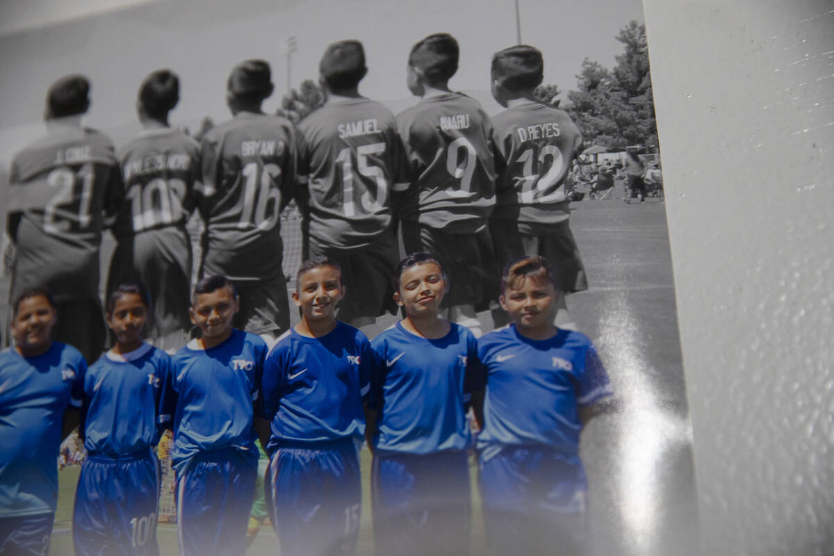 A team picture in the bedroom of Amaru Sinay, second from right, who died earlier this month, a ...