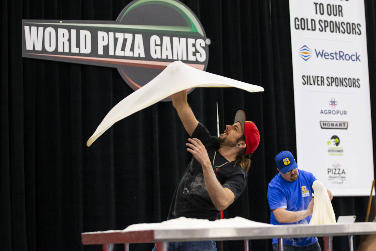 Ben Shanks, of Prescott, Ariz.,competes in the largest dough stretch event during the Internati ...