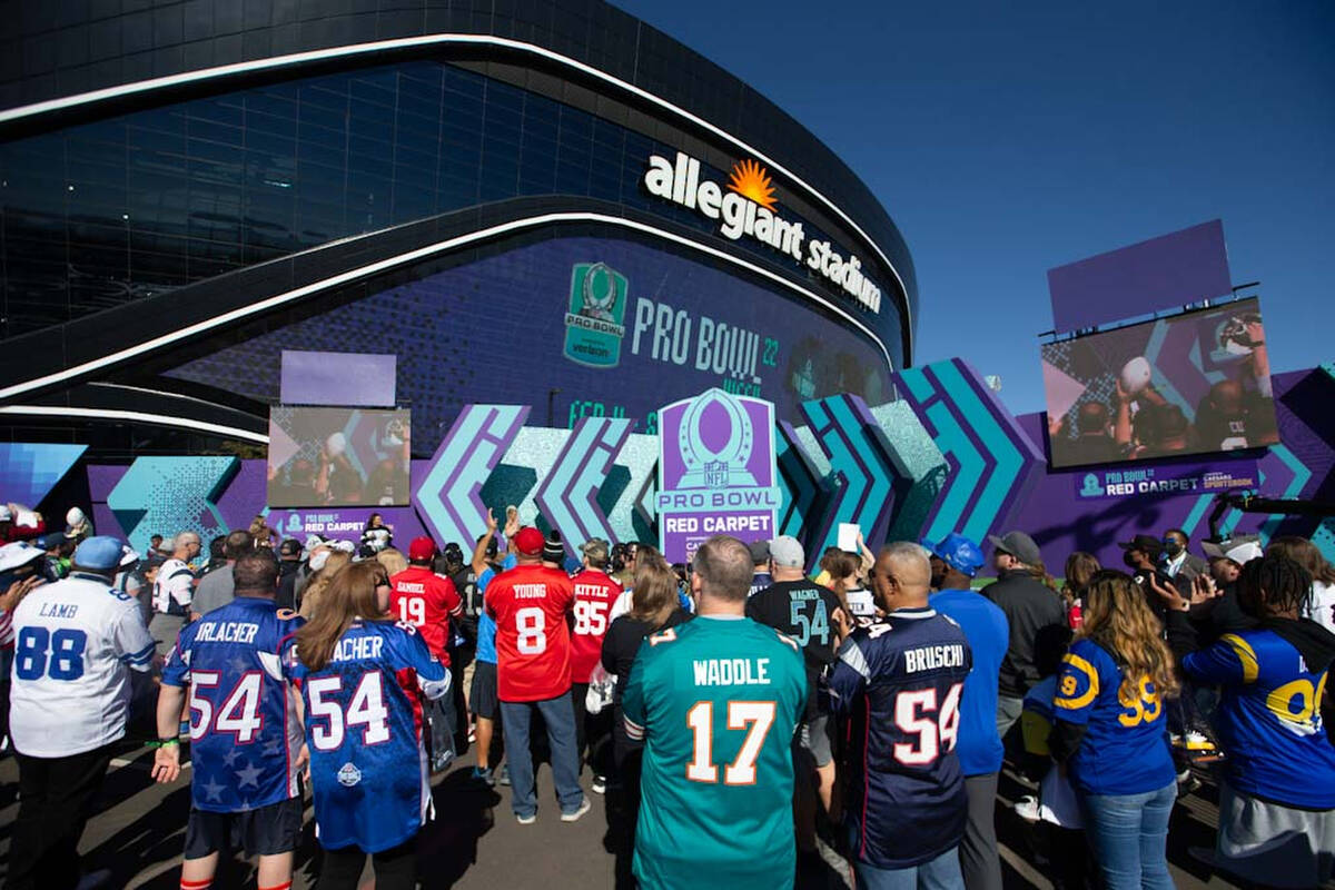 Fans watch NFL players get introduced on the red carpet during the Pro Bowl pregame festivities ...