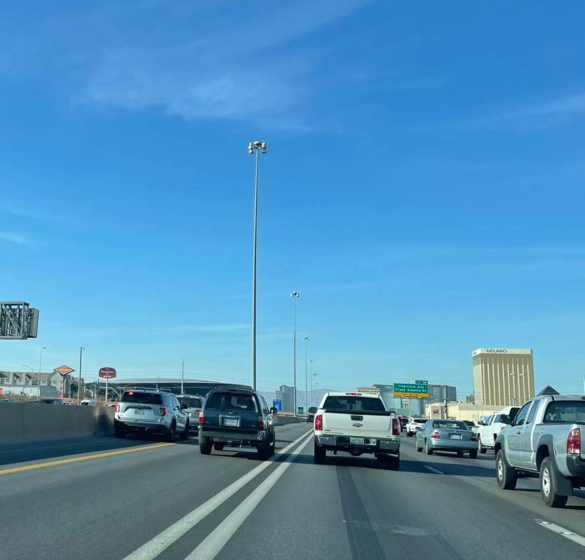 A Nevada State Police Trooper pulls over a motorist in a Interstate 15 HOV lane in Las Vegas on ...