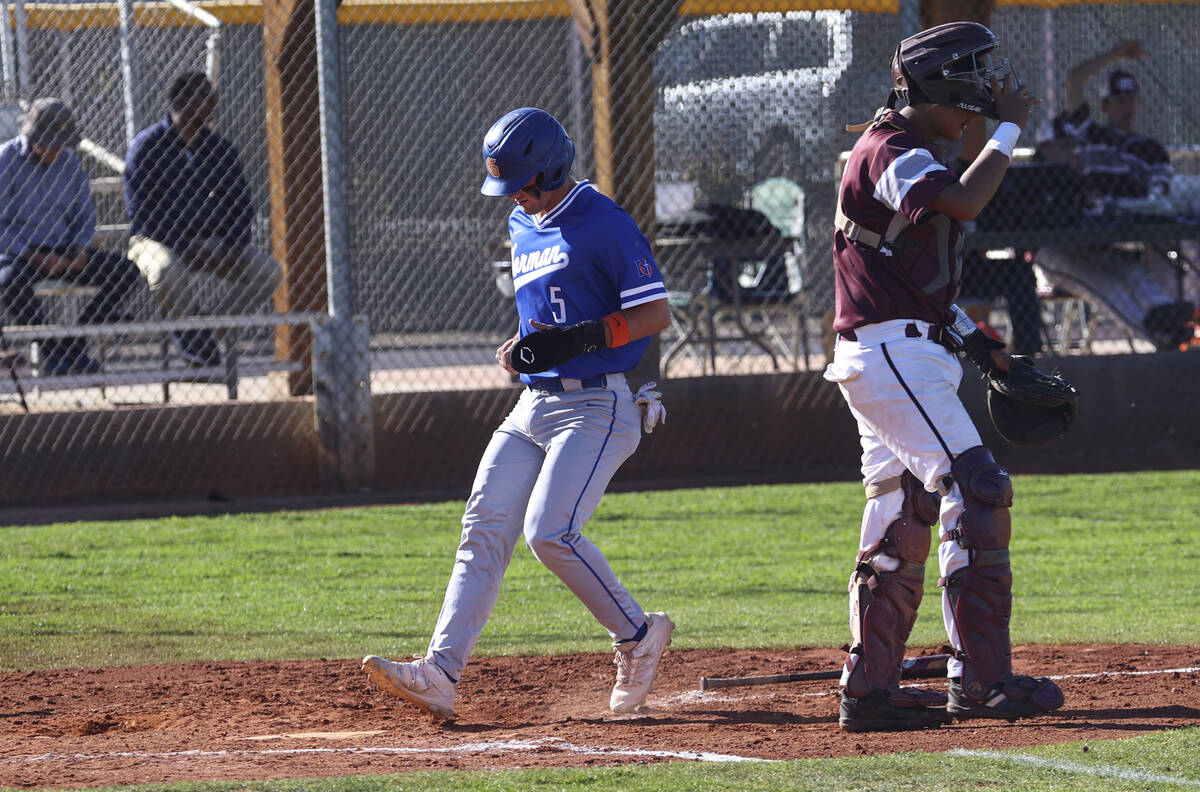 Bishop Gorman’s Demitri Diamant (5) scores past Cimarron-Memorial catcher Arturo Flores ...