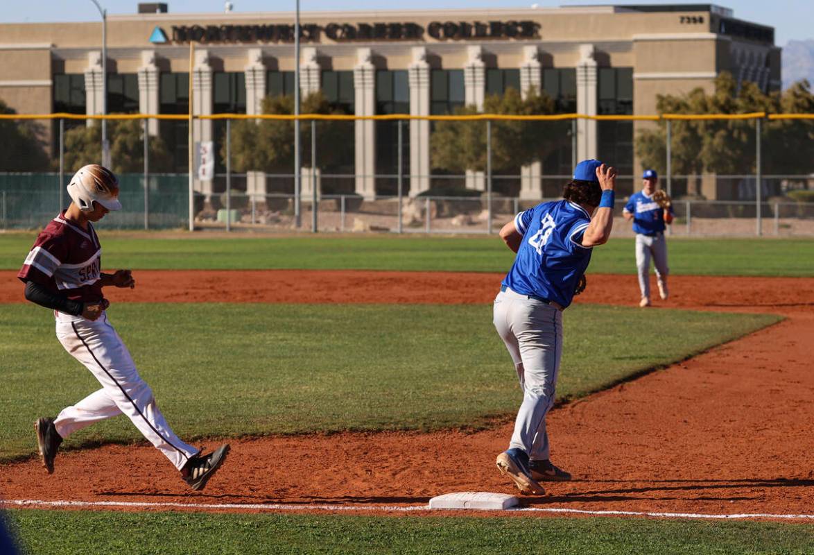 Bishop Gorman first baseman Easton Shelton (28) throws the ball after making a catch to put out ...