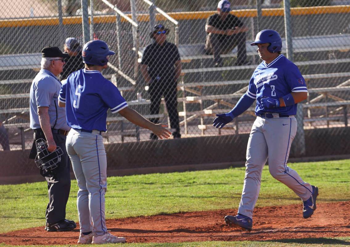 Bishop Gorman shortstop/pitcher Demitri Diamant (5) and third baseman/pitcher Gunnar Myro (8) c ...