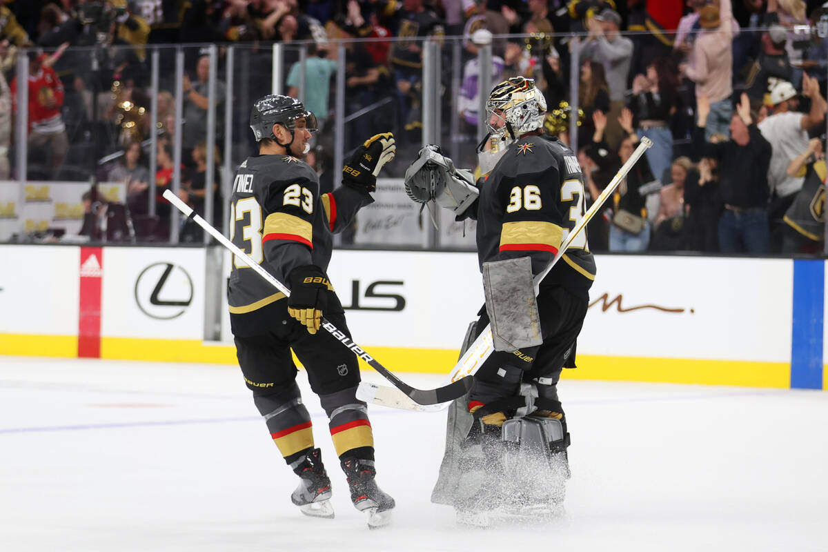 Vegas Golden Knights defenseman Alec Martinez (23) and goaltender Logan Thompson (36) celebrate ...