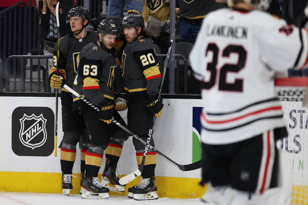 Vegas Golden Knights center Chandler Stephenson (20) celebrates his goal with center Jack Eiche ...