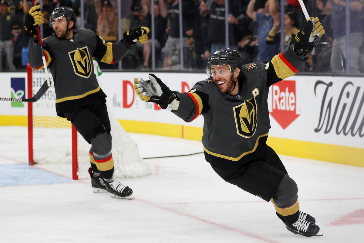 Vegas Golden Knights center Michael Amadio (22) and center Jonathan Marchessault (81) celebrate ...