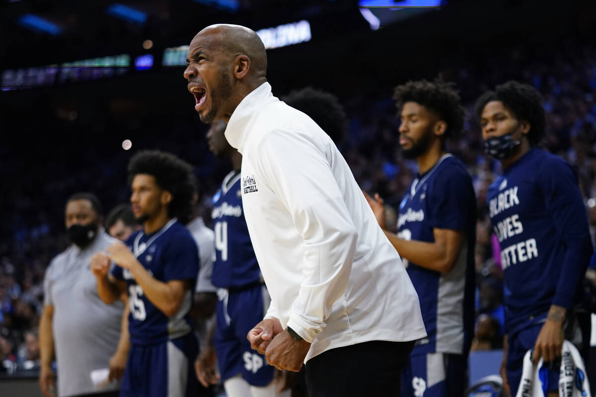 St. Peter's head coach Shaheen Holloway reacts during the first half of a college basketball ga ...