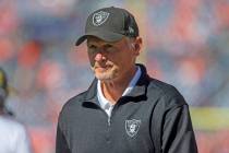 Raiders general manager Mike Mayock walks the field before an NFL football game against the Den ...