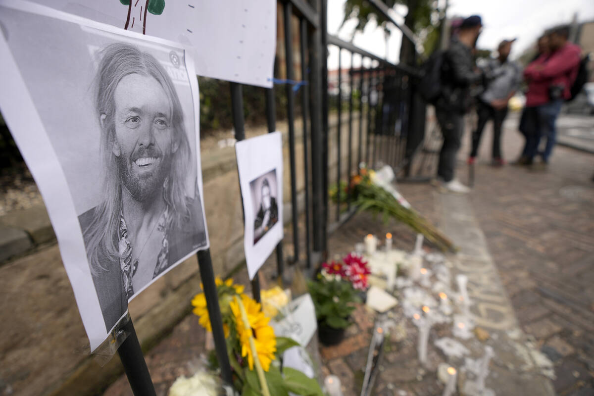 An image of Foo Fighters' drummer Taylor Hawkins adorns a makeshift memorial outside the hotel ...