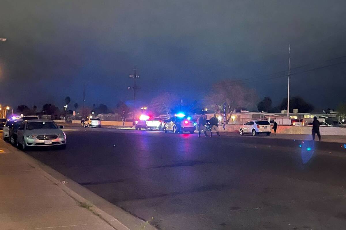 Police secure an area in the 2000 block of Palm Street where Metropolitan Police Department off ...