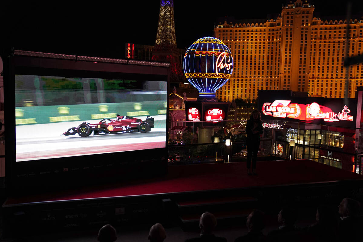 A screen show Charles Leclerc driving a Ferrari, during a news conference announcing a 2023 For ...