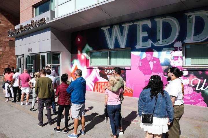 Couples wait in line for marriage certificates at the Marriage License Bureau on Sunday, Feb. 1 ...