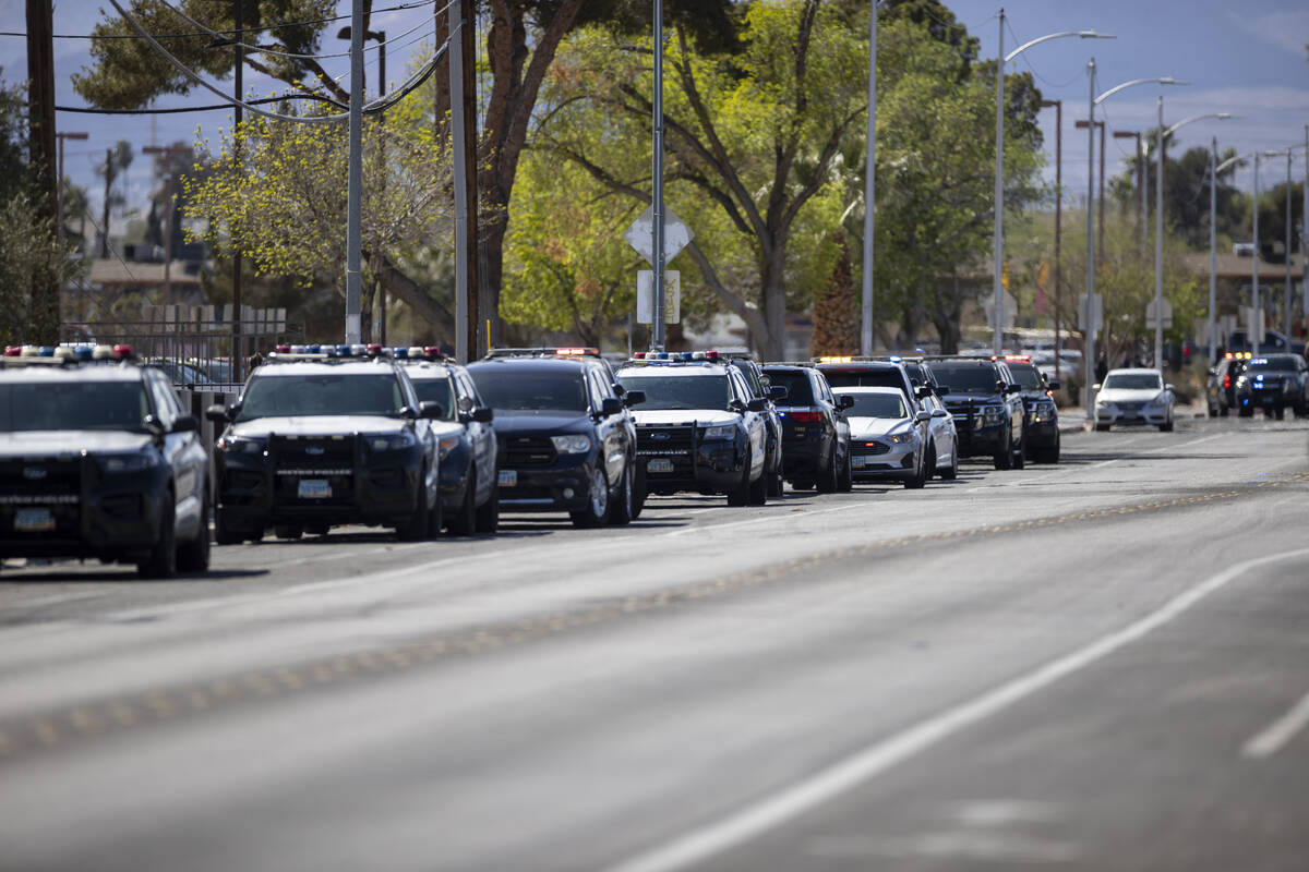 Police investigate a shooting at Western High School in Las Vegas, Tuesday, March 29, 2022. (Er ...