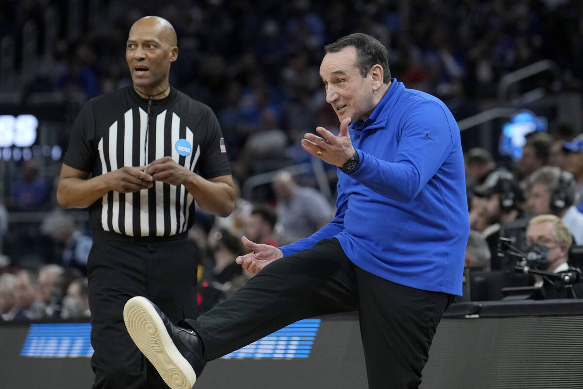 Duke head coach Mike Krzyzewski, right, reacts during the first half of his team's college bask ...