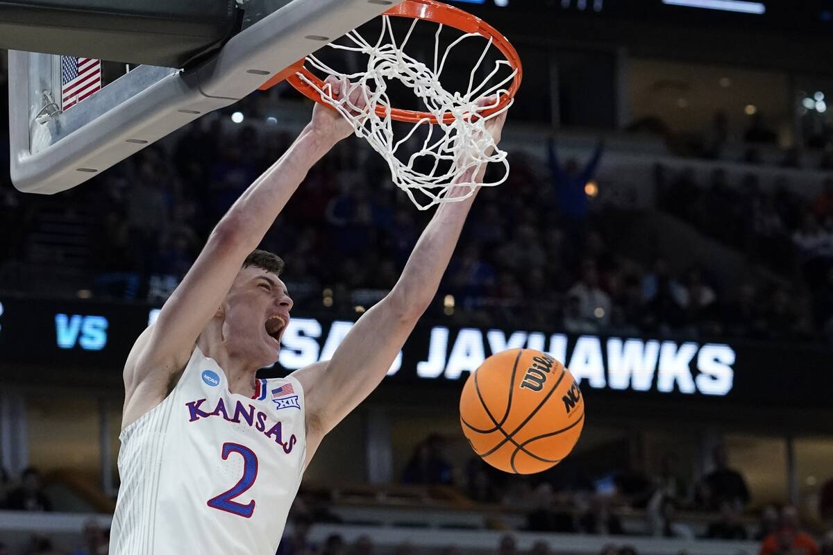 Kansas' Christian Braun dunks during the second half of a college basketball game in the Elite ...