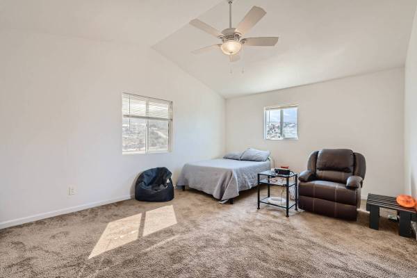 The primary bedroom inside a house at 73 Pinon Road, Cold Creek, Nevada. It's a home for sale a ...