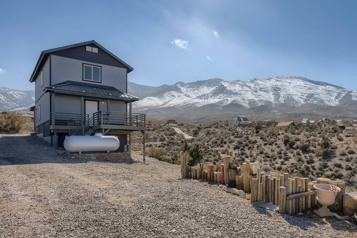 The scenic backyard view behind a house at 73 Pinon Road, Cold Creek, Nevada. It's a home for s ...