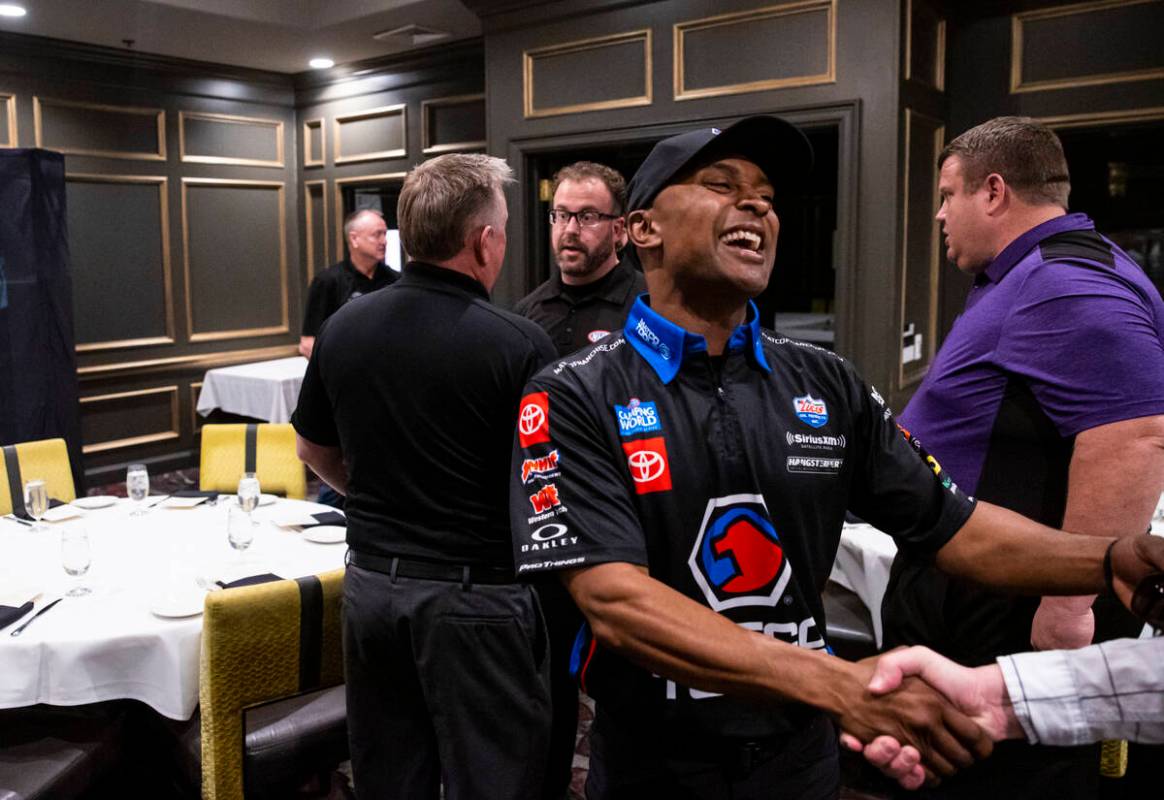 Toyota Top Fuel driver Antron Brown greets Review-Journal columnist Ron Kantowski before a pres ...