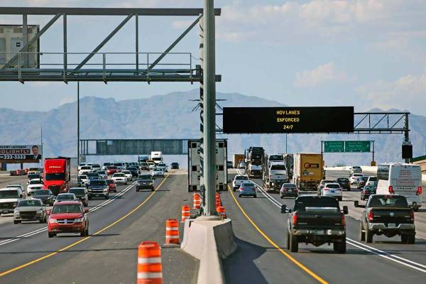 The high occupancy vehicle lanes are largely empty in both directions on Interstate 15 near the ...