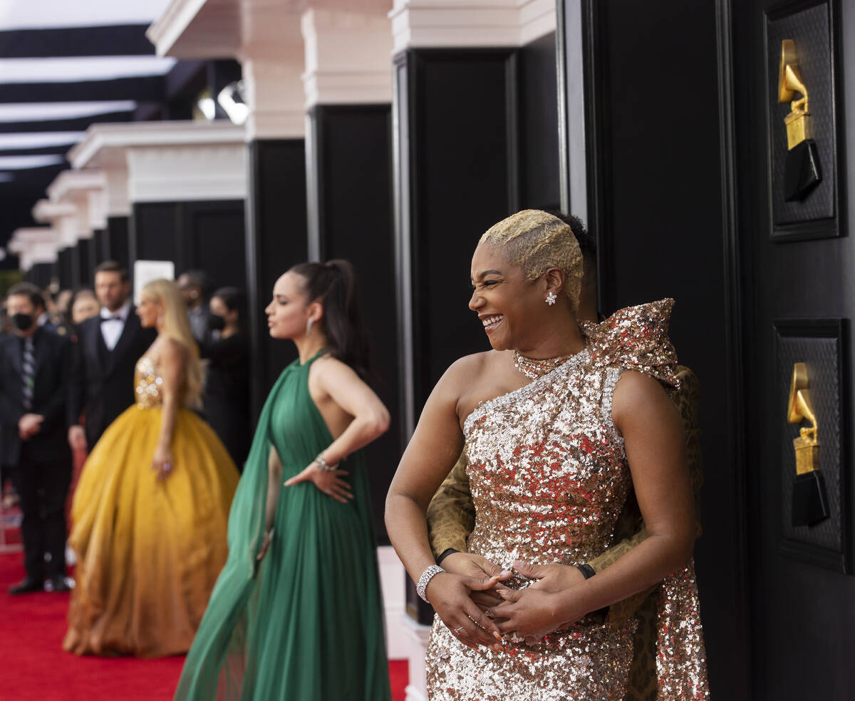 Tiffany Haddish, right, on the red carpet before the start of the 2022 Grammy Awards on Sunday, ...
