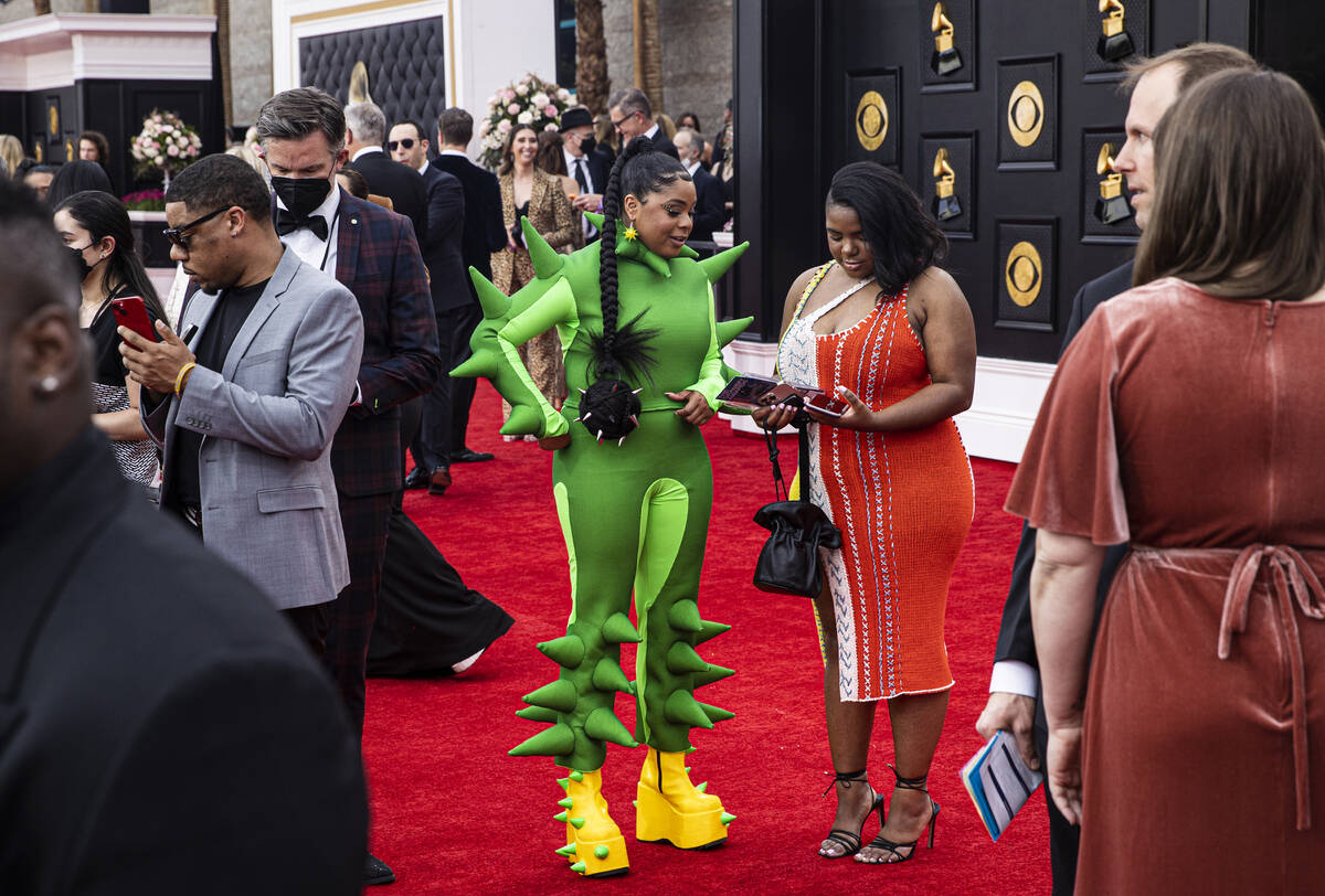 Tayla Parx, green outfit, on the red carpet before the start of the 2022 Grammy Awards on Sunda ...
