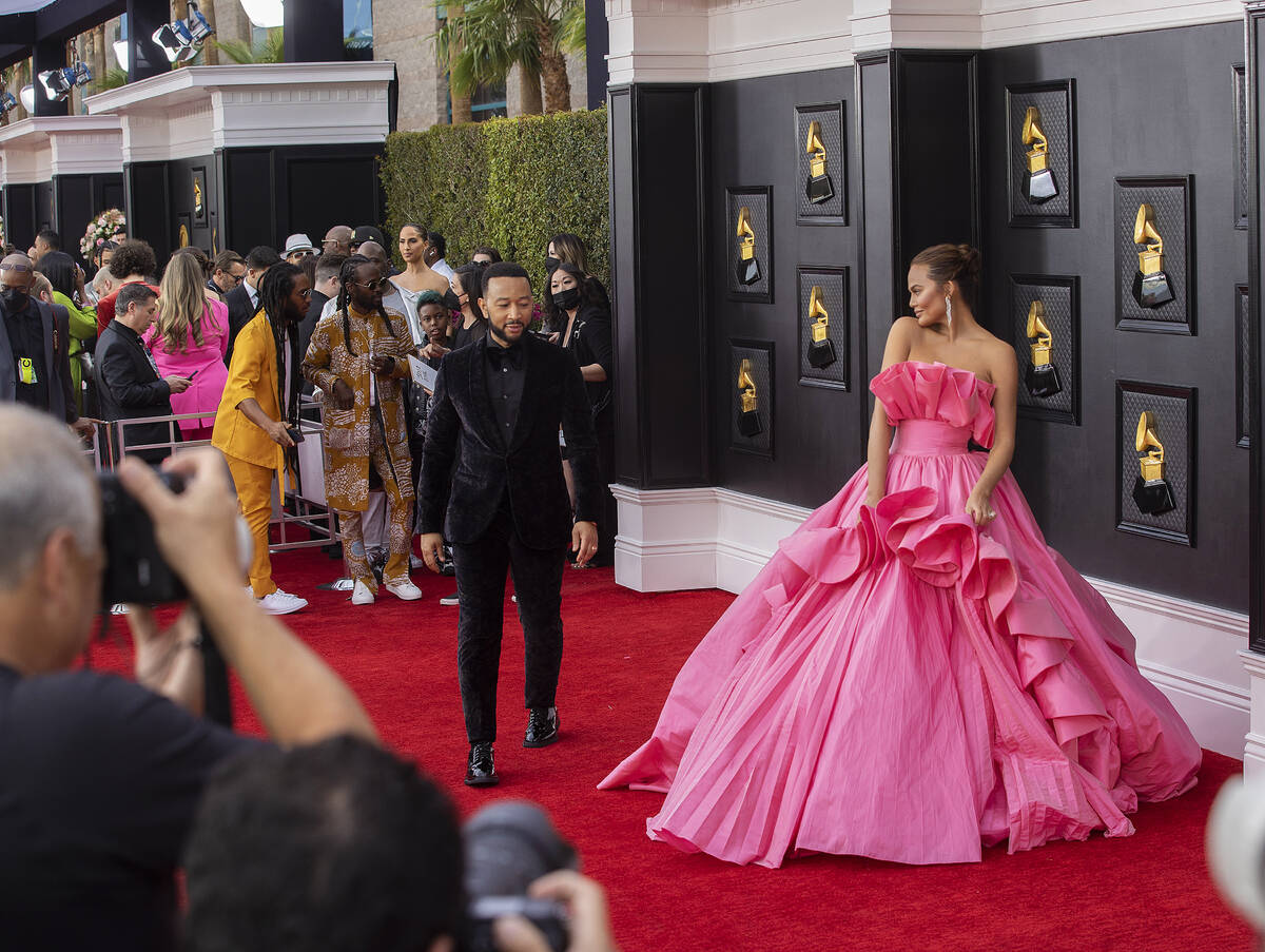 John Legend, top/left, and wife Chrissy Teigen on the red carpet before the start of the 2022 G ...